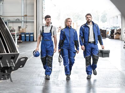 Kübler Bodyforce serija Drei Arbeiter mit Arbeitskleidung.